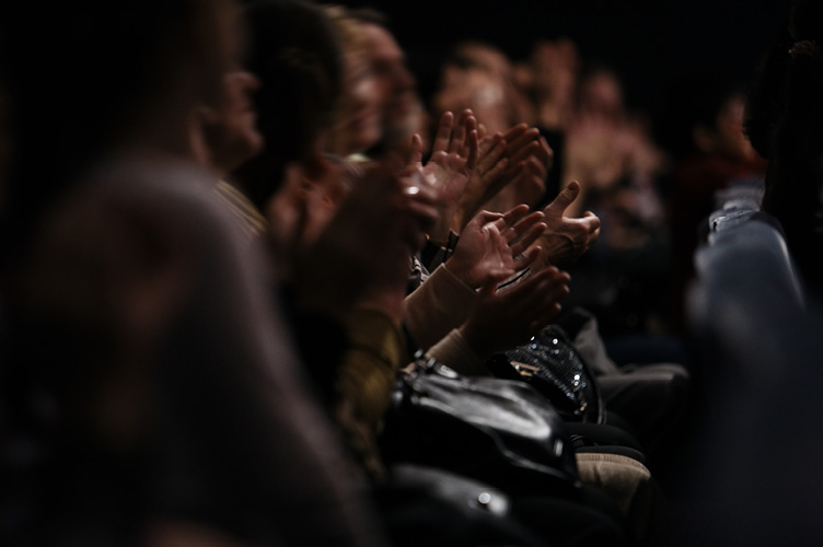 Congregation with hands open to receive blessing