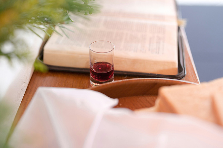 small cup of juice and bread