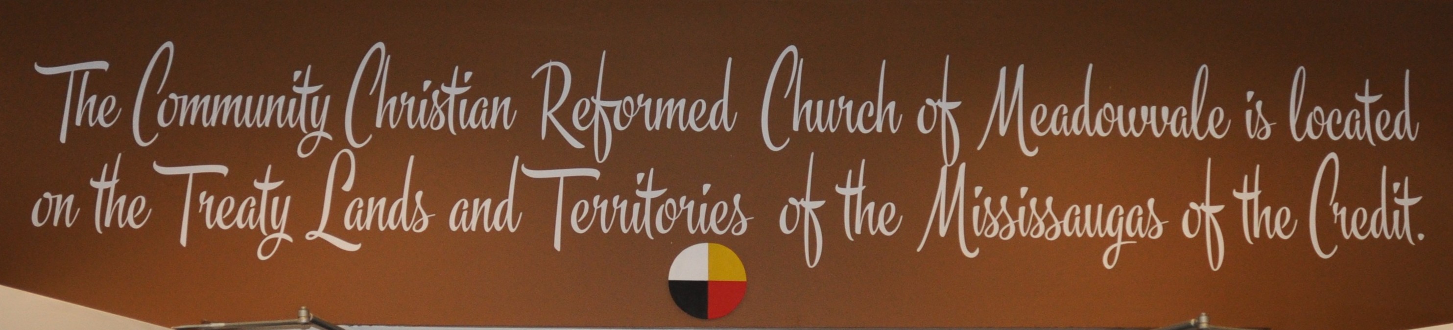 Land acknowledgement painted above door of church
