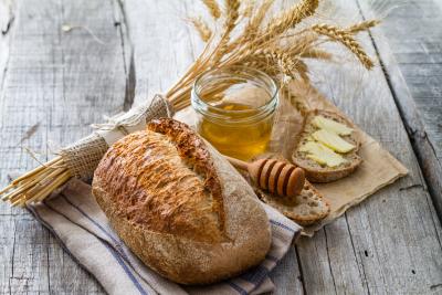Bundle of weat, loaf of bread, honey jar