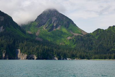 Lake, mountains, clouds covering mountains
