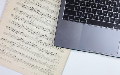 Sheet music and a laptop