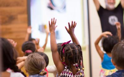 Child with hands raised