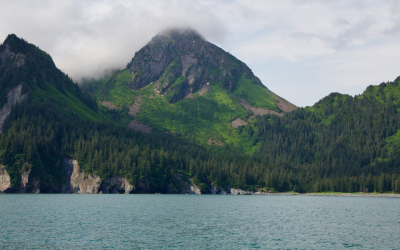 Lake, mountains, clouds covering mountains
