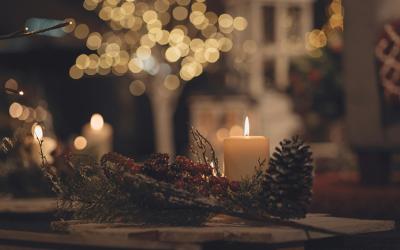 Christmas scene with candle and a pinecone
