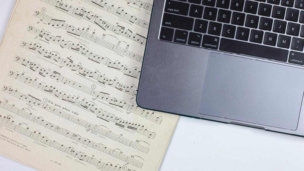 Sheet music and a laptop