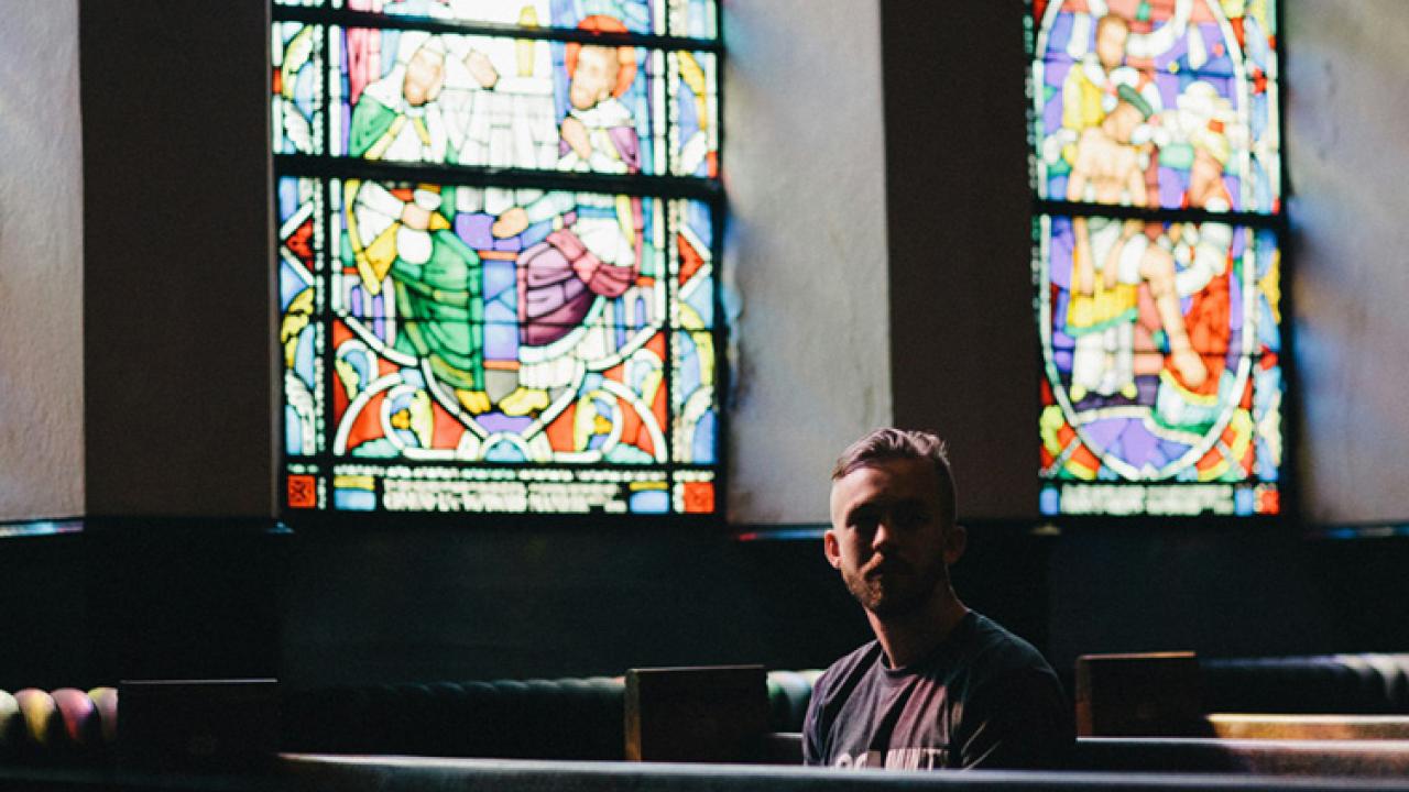 Person sitting in pew
