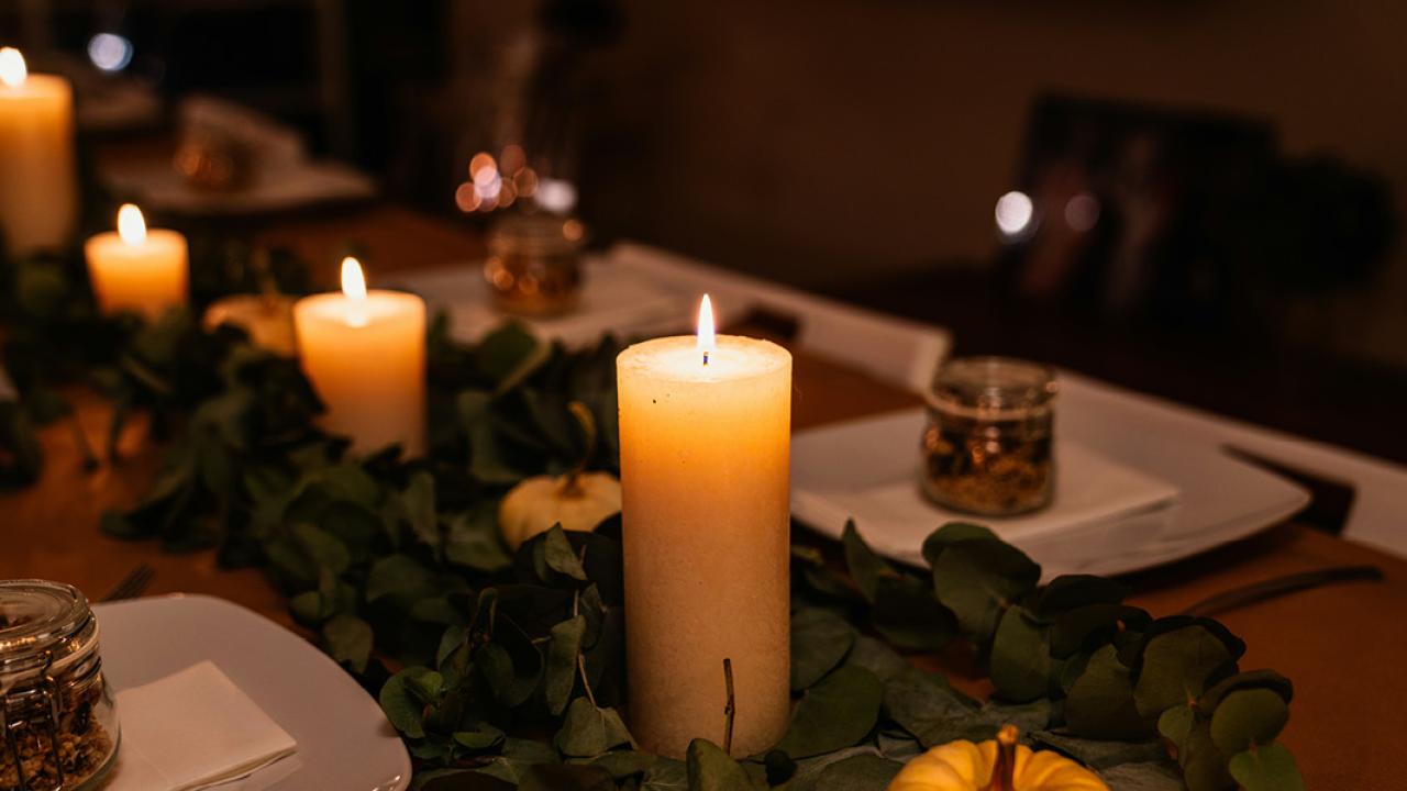 Thanksgiving setup with candles and pumpkins