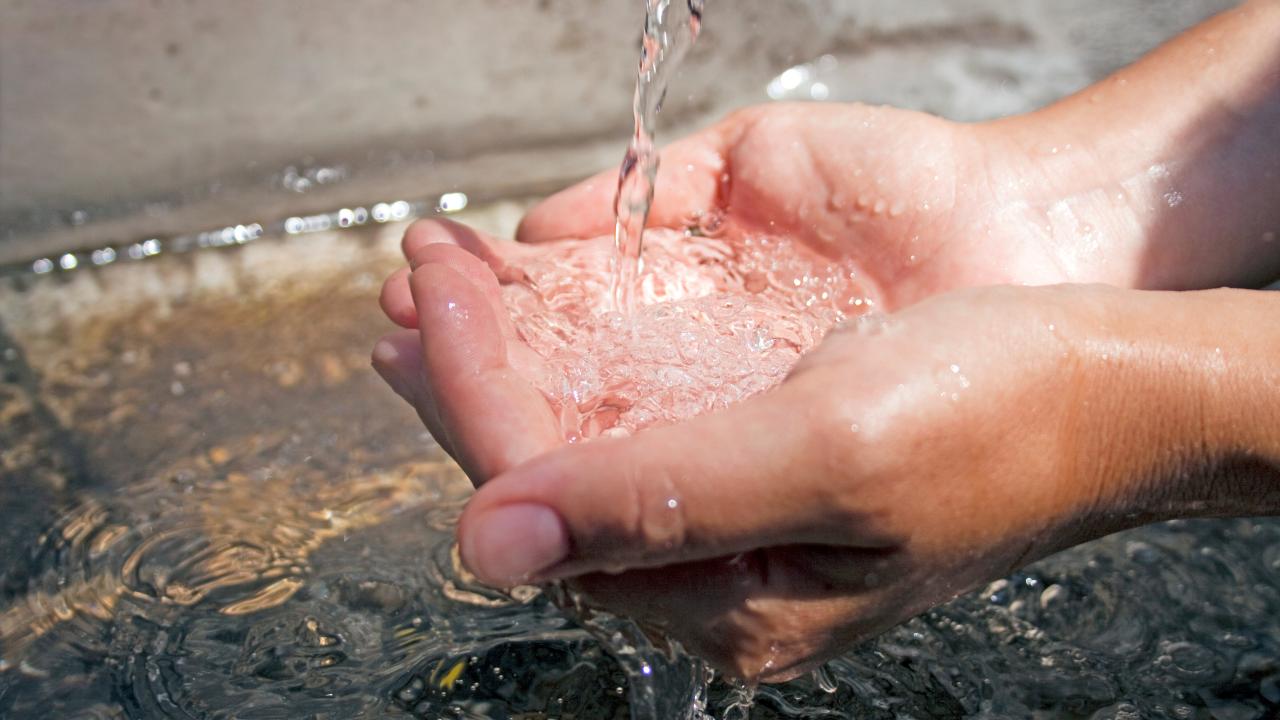 Hands in water