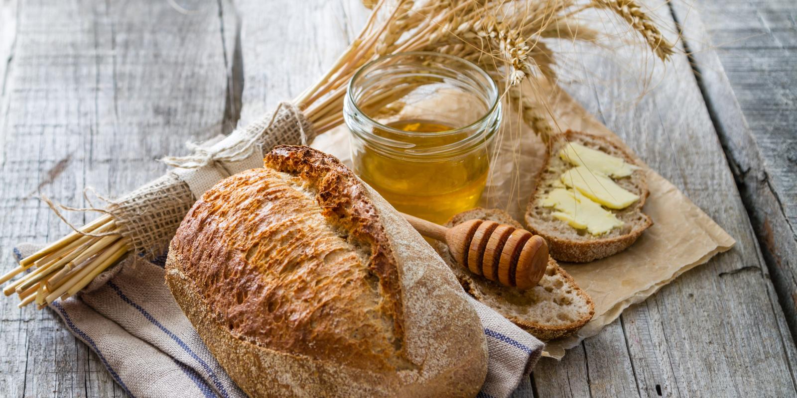 Bundle of weat, loaf of bread, honey jar