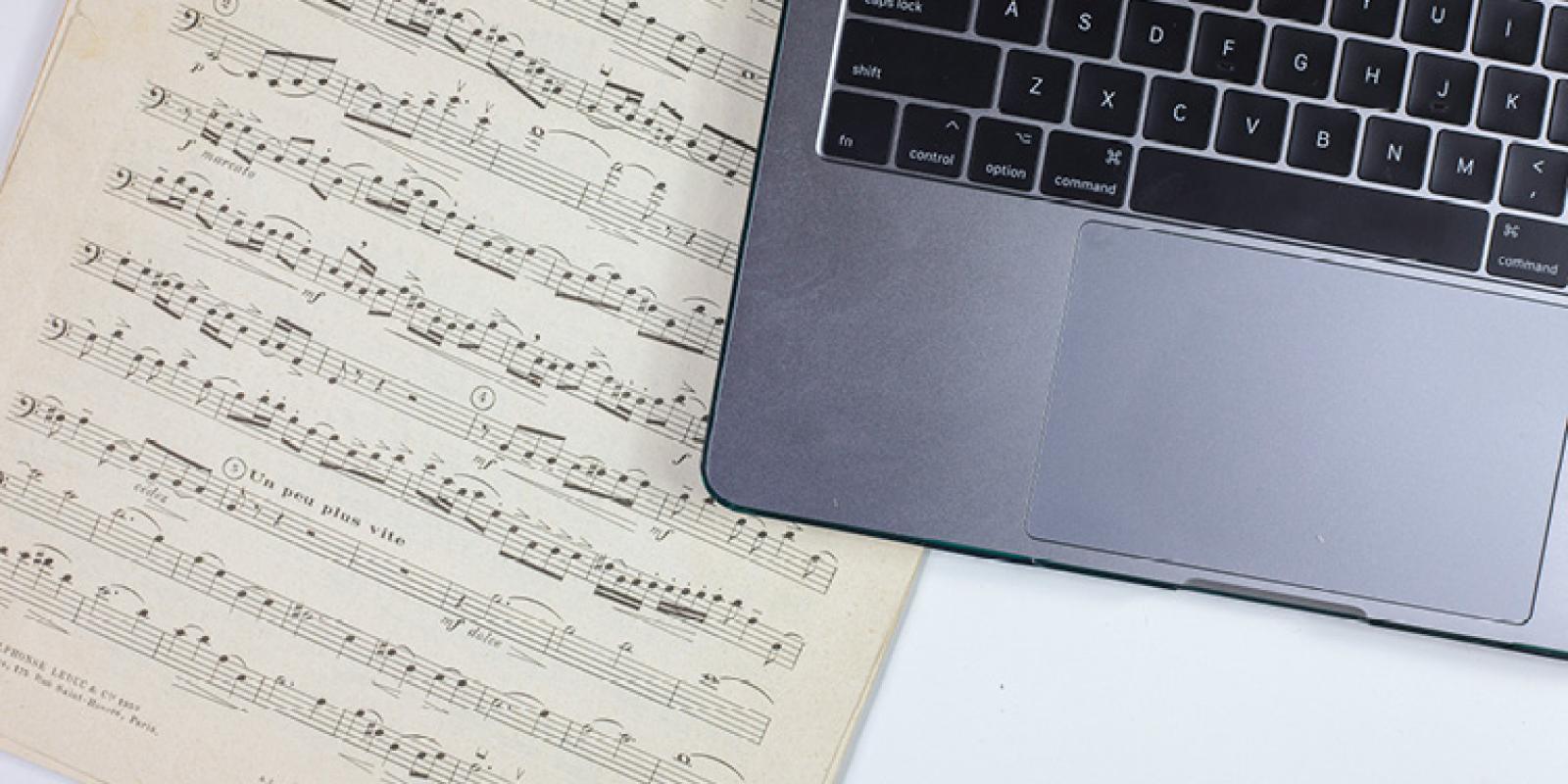 Sheet music and a laptop