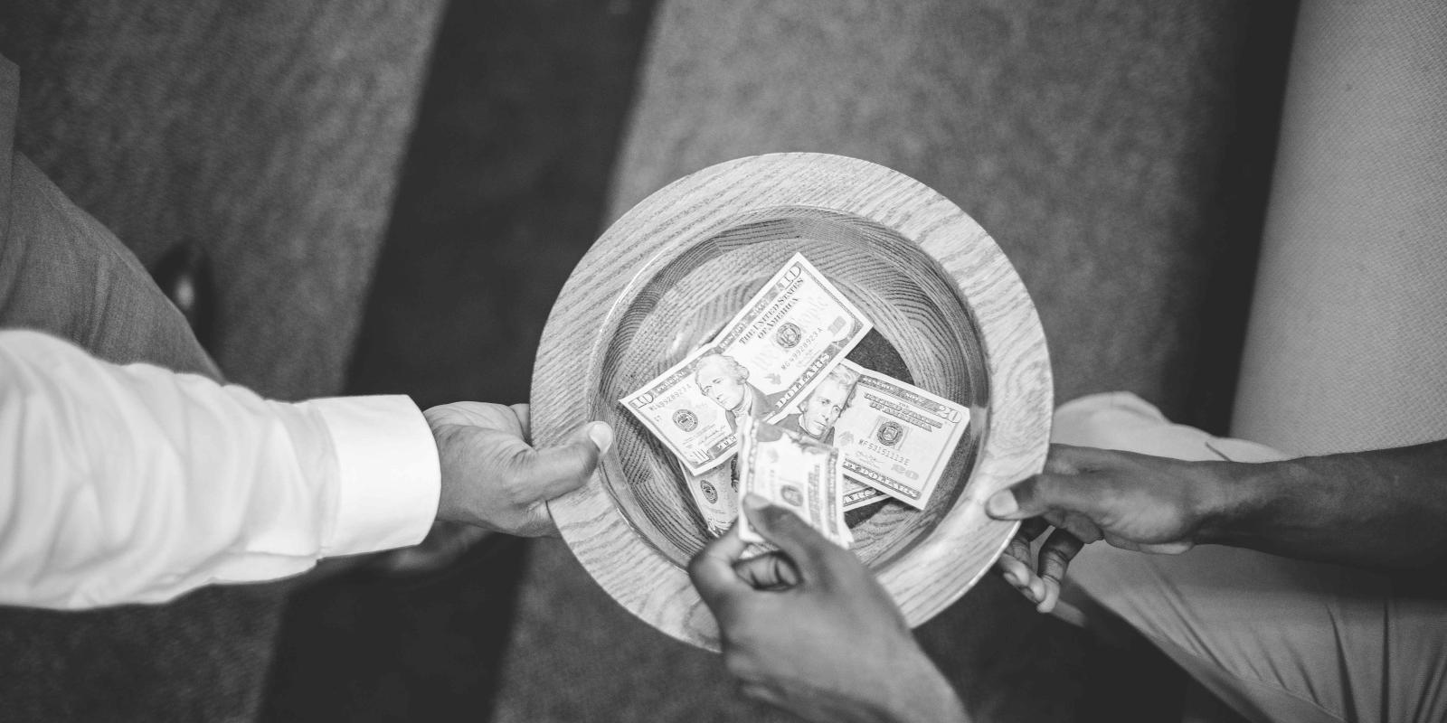 Overhead shot of the offering plate being passed